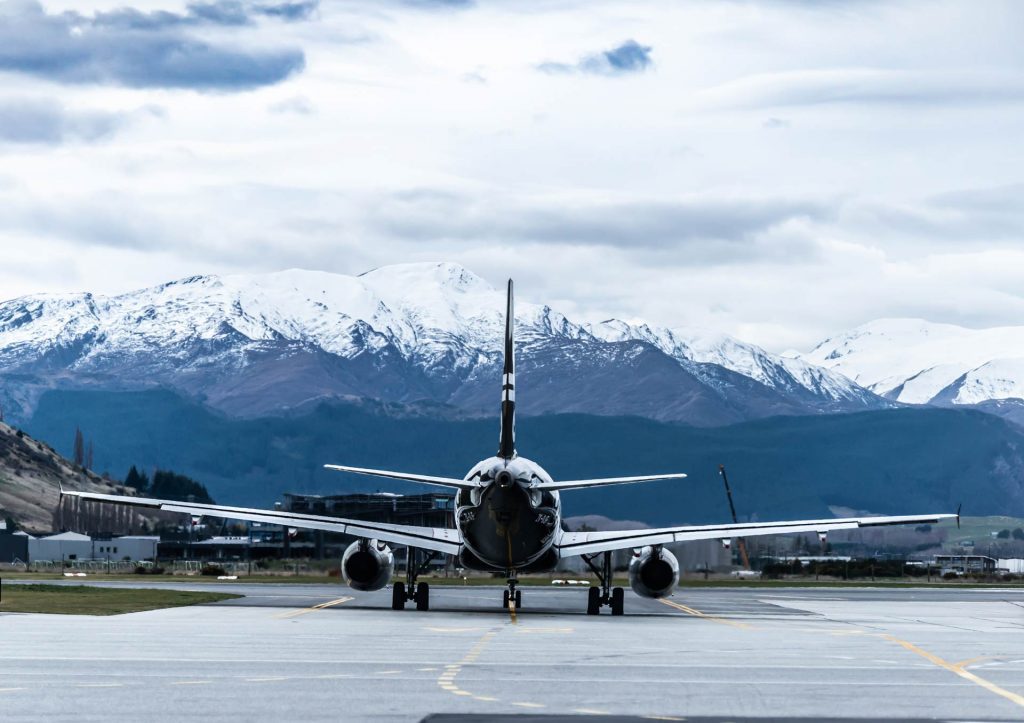 Airplane in front of mountains